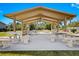 A covered pavilion offers tables and bench seating perfect for gathering outside at 3300 Loveland Blvd # 3203, Punta Gorda, FL 33980