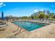 A community pool featuring lounge chairs along the deck offers relaxation on a sunny day at 3300 Loveland Blvd # 3203, Punta Gorda, FL 33980