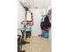 A walk-in closet with an exercise bike and custom shelving at 3300 Loveland Blvd # 3203, Punta Gorda, FL 33980