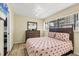 Light and airy bedroom showcasing a comfortable bed and contemporary dresser at 3523 Longmeadow # 12, Sarasota, FL 34235