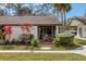 Inviting front porch with brick flooring and cozy seating area at 3523 Longmeadow # 12, Sarasota, FL 34235