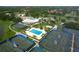 Spacious community pool, tennis courts and clubhouse with lush landscaping offer a resort-style living at 3837 Torrey Pines Blvd, Sarasota, FL 34238