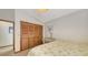 Bedroom featuring a closet, desk, and a comfortable bed with a pleasant print at 3837 Torrey Pines Blvd, Sarasota, FL 34238