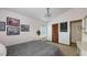 Bright bedroom with a vanity, closet, and comfortable bed at 3837 Torrey Pines Blvd, Sarasota, FL 34238