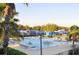 Relaxing community swimming pool with lounge chairs and palm trees offering resort style living at 3837 Torrey Pines Blvd, Sarasota, FL 34238