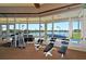 Bright fitness center with modern equipment and scenic lake views at 3837 Torrey Pines Blvd, Sarasota, FL 34238