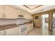 Well-lit kitchen features tile floors, modern appliances, and stylish countertops at 3837 Torrey Pines Blvd, Sarasota, FL 34238