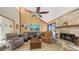 Spacious living room featuring a stone fireplace, vaulted ceilings, and comfortable seating at 3837 Torrey Pines Blvd, Sarasota, FL 34238