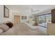 Spacious main bedroom with a ceiling fan and sliding glass doors leading to the outdoors at 3837 Torrey Pines Blvd, Sarasota, FL 34238