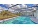 Beautiful pool inside of the screened patio with views of the pond and golf course at 3837 Torrey Pines Blvd, Sarasota, FL 34238