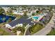 Overhead shot of the community, showcasing the pool, clubhouse, and manicured landscaping near waterfront at 4721 Mount Vernon Dr, Bradenton, FL 34210