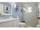Modern bathroom with blue walls and a large glass shower and marble countertop at 4721 Mount Vernon Dr, Bradenton, FL 34210