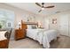 Comfortable bedroom with a fan, closet, and a light wood bed with bright decor at 4721 Mount Vernon Dr, Bradenton, FL 34210