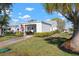 Charming single-story home with a covered carport, American flag, and well-maintained lawn at 4721 Mount Vernon Dr, Bradenton, FL 34210
