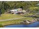 Outdoor kayak storage facility with a variety of colorful kayaks stacked and secured in a fenced area at 4721 Mount Vernon Dr, Bradenton, FL 34210