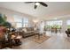 Inviting living room featuring a comfortable sofa, glass coffee table, and sunny windows at 4721 Mount Vernon Dr, Bradenton, FL 34210