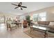 Open concept living room and dining space with modern furnishings and bright lighting at 4721 Mount Vernon Dr, Bradenton, FL 34210
