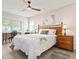 Cozy bedroom with a bamboo bed frame, neutral colors, and plenty of natural light at 4721 Mount Vernon Dr, Bradenton, FL 34210