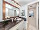 Bathroom with a modern vanity, large mirror, and a well-lit area at 4822 Ocean Blvd # 2D, Sarasota, FL 34242