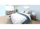 Cozy bedroom featuring a comfortable bed, neutral colors, and soft lighting at 4822 Ocean Blvd # 2D, Sarasota, FL 34242