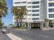 Inviting entrance to 4822 Ocean Blvd with well-maintained landscaping and gated access to this waterfront building at 4822 Ocean Blvd # 2D, Sarasota, FL 34242