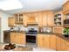 Well-equipped kitchen with stainless steel appliances and custom wood cabinetry at 4822 Ocean Blvd # 2D, Sarasota, FL 34242