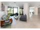 Modern lobby featuring stylish furniture, tile flooring, and large windows with garden views and lots of natural light at 4822 Ocean Blvd # 2D, Sarasota, FL 34242