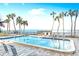Gorgeous pool area with ocean views and lounge chairs creating an ideal outdoor retreat at 4822 Ocean Blvd # 2D, Sarasota, FL 34242
