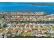 Aerial view of a waterfront community with canals, boat docks, and stunning views of the open bay at 4912 Beacon Rd, Palmetto, FL 34221