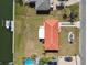 Aerial view of the home, showing the terra cotta roof, proximity to water, and the neighborhood layout at 4912 Beacon Rd, Palmetto, FL 34221