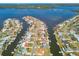 Aerial view of a waterfront community with numerous canals, boat docks, and access to Tampa Bay at 4912 Beacon Rd, Palmetto, FL 34221