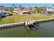 Aerial view of a home featuring a private boat lift and easy access to the canal system and open water at 4912 Beacon Rd, Palmetto, FL 34221