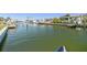 Scenic backyard canal view with boat docks for waterfront living and easy access to boating activities at 4912 Beacon Rd, Palmetto, FL 34221