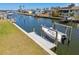 Private dock and boat lift with canal access to the open bay and Gulf of Mexico, perfect for boating enthusiasts at 4912 Beacon Rd, Palmetto, FL 34221