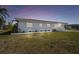 Charming single-story home featuring white brick and a red tile roof, set in a neatly manicured lawn at 4912 Beacon Rd, Palmetto, FL 34221