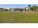 Expansive front yard featuring a well-maintained lawn and a charming single-story home with a terra cotta tile roof at 4912 Beacon Rd, Palmetto, FL 34221