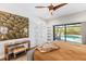 Bedroom with a decorative painting, modern furniture, and sliding glass doors to a pool area at 525 S Shore Dr, Osprey, FL 34229