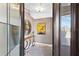 Stylish foyer with a unique console table, decorative mirror, and modern artwork at 525 S Shore Dr, Osprey, FL 34229