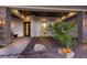Inviting front entrance with elegant stone accents, manicured garden, and a modern doorway at 525 S Shore Dr, Osprey, FL 34229