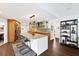 Spacious open kitchen featuring a center island with seating, granite countertops, and modern appliances at 525 S Shore Dr, Osprey, FL 34229