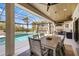 Outdoor space boasts a screened-in pool area with a built-in outdoor kitchen for entertaining at 525 S Shore Dr, Osprey, FL 34229