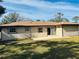 Back exterior featuring a backyard, back patio and a glimpse of the vinyl fence at 5470 Ansonia Ter, North Port, FL 34287