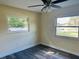 Bedroom featuring a ceiling fan and windows at 5470 Ansonia Ter, North Port, FL 34287