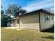 Exterior view of house showing siding and back patio at 5470 Ansonia Ter, North Port, FL 34287