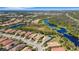Aerial view of the property nestled in a beautiful community with ponds and lush greenery at 5946 Caspian Tern Dr, Sarasota, FL 34238