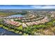 Aerial view of the property, showcasing its location in a scenic community near a tranquil lake at 5946 Caspian Tern Dr, Sarasota, FL 34238