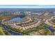 Expansive aerial view of the residential area featuring numerous homes, lakes, and lush landscaping at 5946 Caspian Tern Dr, Sarasota, FL 34238
