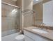 Bathroom featuring single sink vanity with granite counters, toilet and shower with glass doors at 5946 Caspian Tern Dr, Sarasota, FL 34238