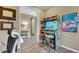Fun game room featuring an arcade machine and stylish decor, offering entertainment and a playful atmosphere at 5946 Caspian Tern Dr, Sarasota, FL 34238