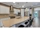 Beautiful kitchen with sleek countertops, stainless steel appliances, and a spacious island with bar seating at 5946 Caspian Tern Dr, Sarasota, FL 34238